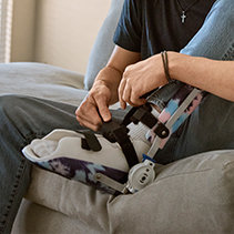 Person putting on medical walking boot