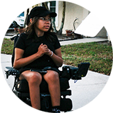 SMA Patient Advocate sitting in a powered wheelchair